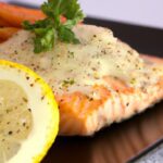 Zesty Baked Salmon with Creamy Lemon Butter Sauce Delight