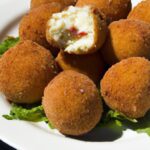 Arancini Unveiled: Mozzarella-Stuffed Sicilian Rice Delights