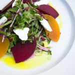 Bright Beet & Goat Cheese Salad Tossed in Citrus Vinaigrette