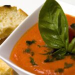Roasted Tomato Bisque Infused with Fragrant Basil Oil
