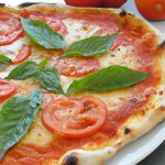 Savor the Classic Margherita Pizza with Fresh Basil Flair