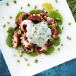 Savoring Charcoal-Grilled Octopus with Creamy Tzatziki Delight